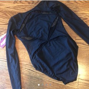 black bodysuit with mesh cutouts on back